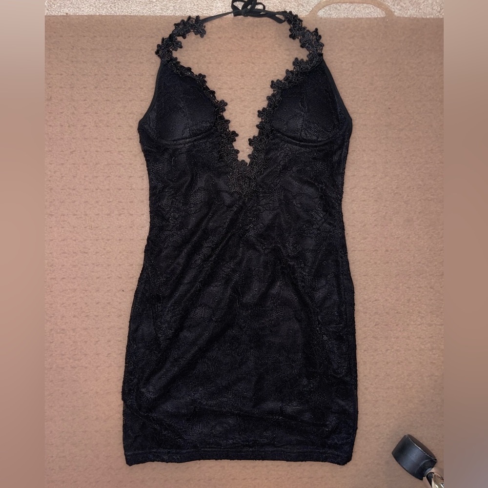 Deep v neck and low back short fitted dress. Corset type top